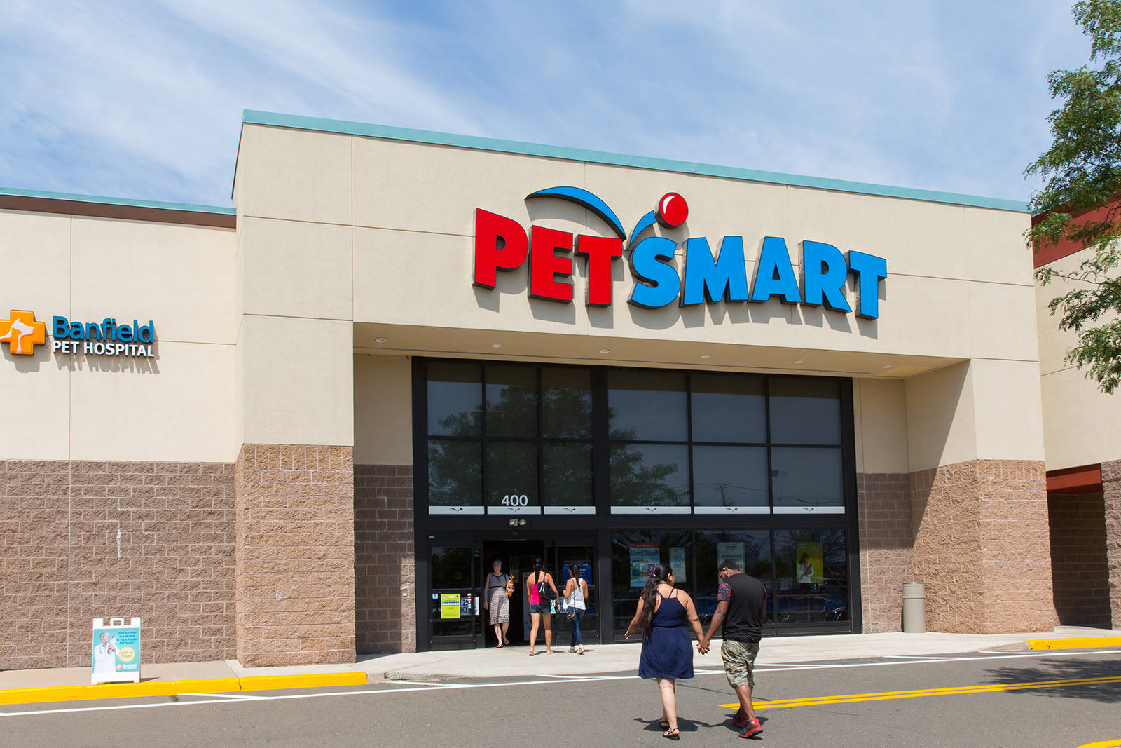 Couple entering PetSmart at North Haven Crossing.