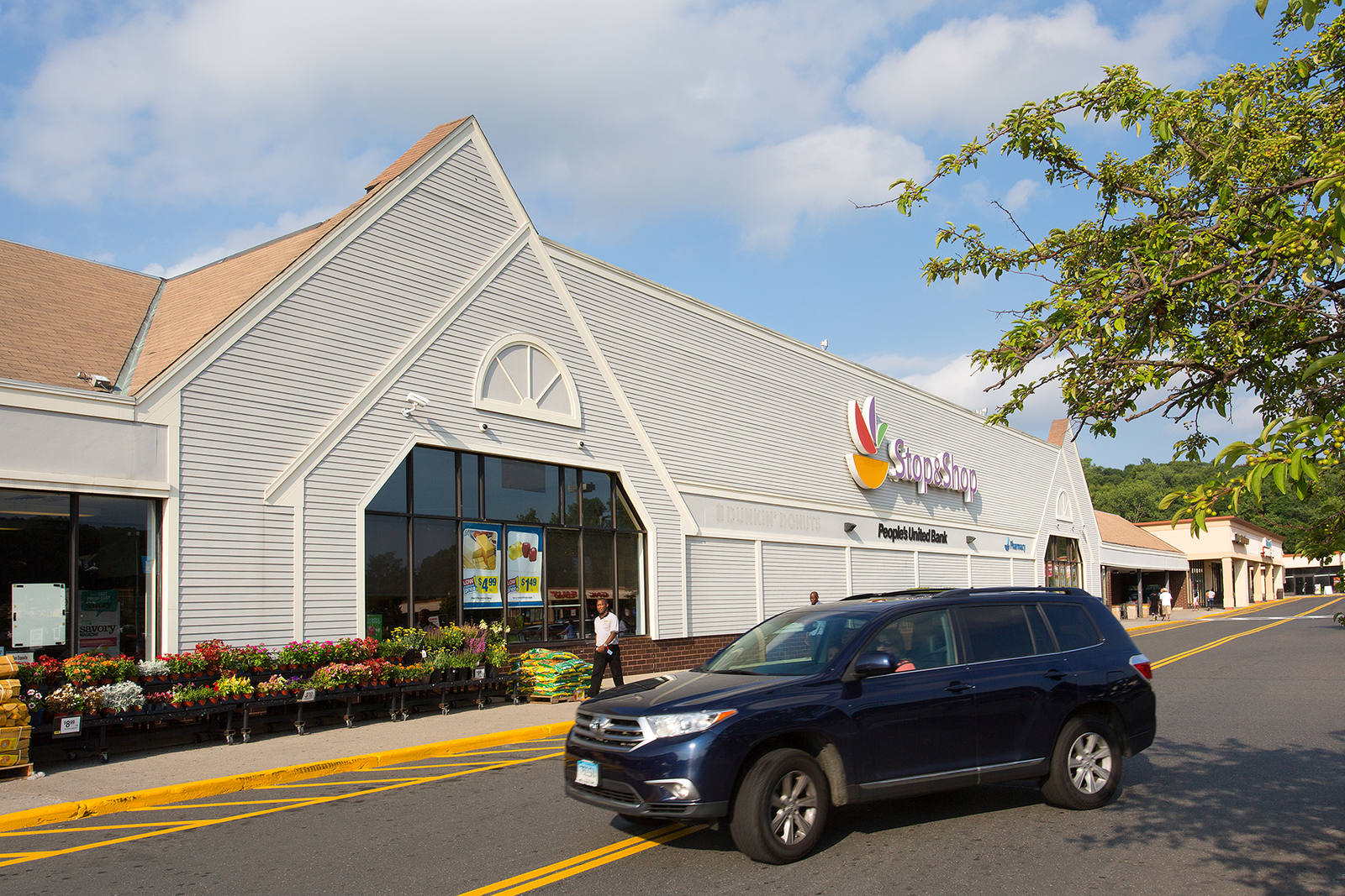 Black SUV in front of Shop Rite entrance