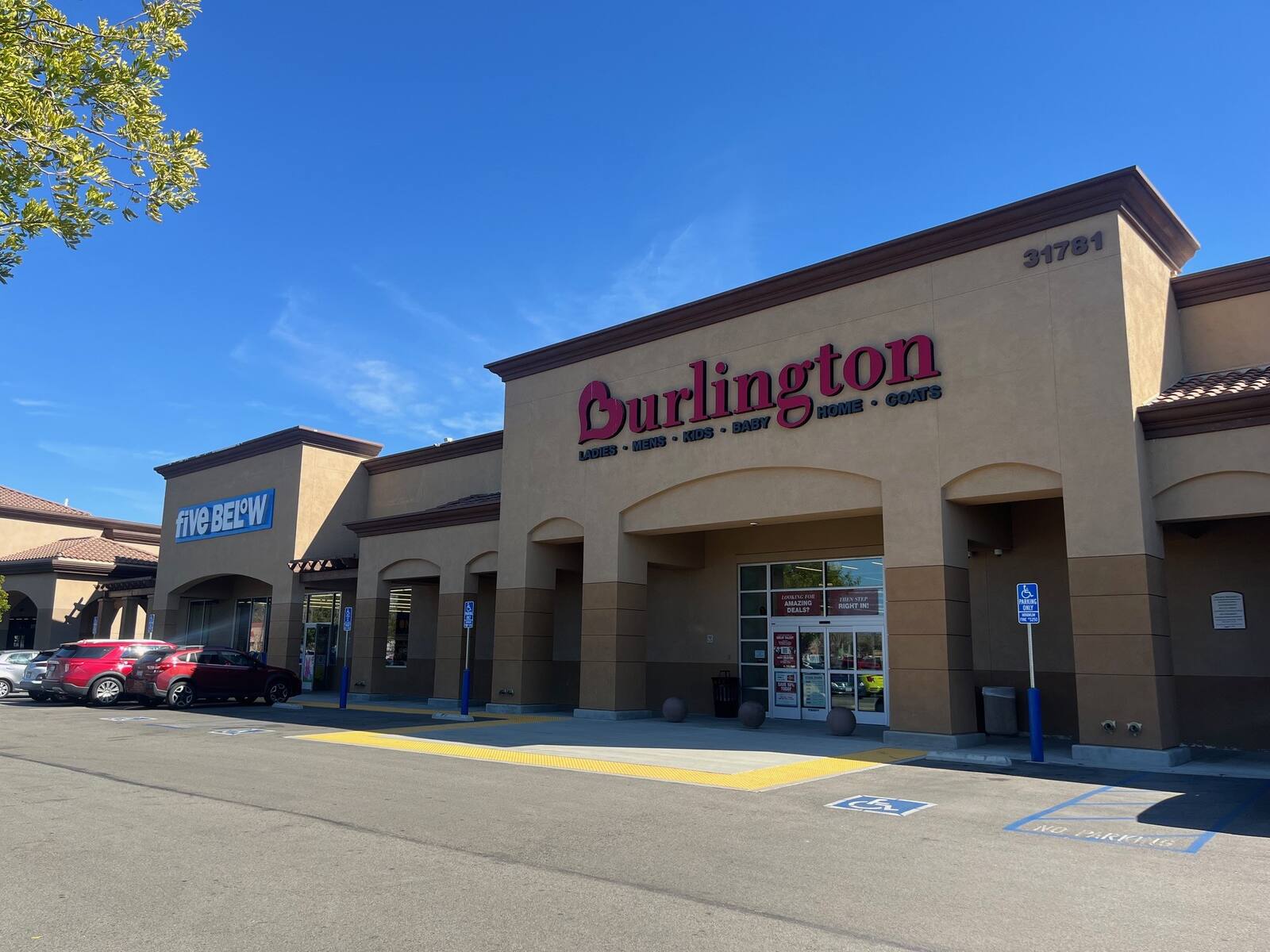 Burlington and Five Below with parked cars on the left.