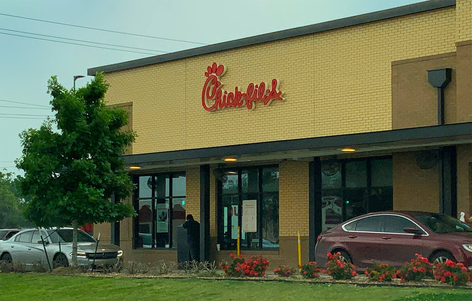 Cars waiting in drive thru of Chick-fil-A at Orange Grove shopping center