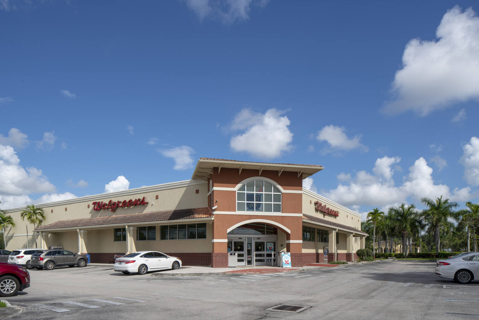 Walgreens pharmacy with palm trees behind it at Marketplace at Wycliffe.