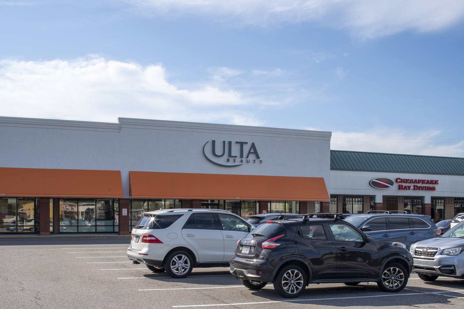 Ulta Beauty supply with SUVs in parking lot at Virginia Beach, VA.