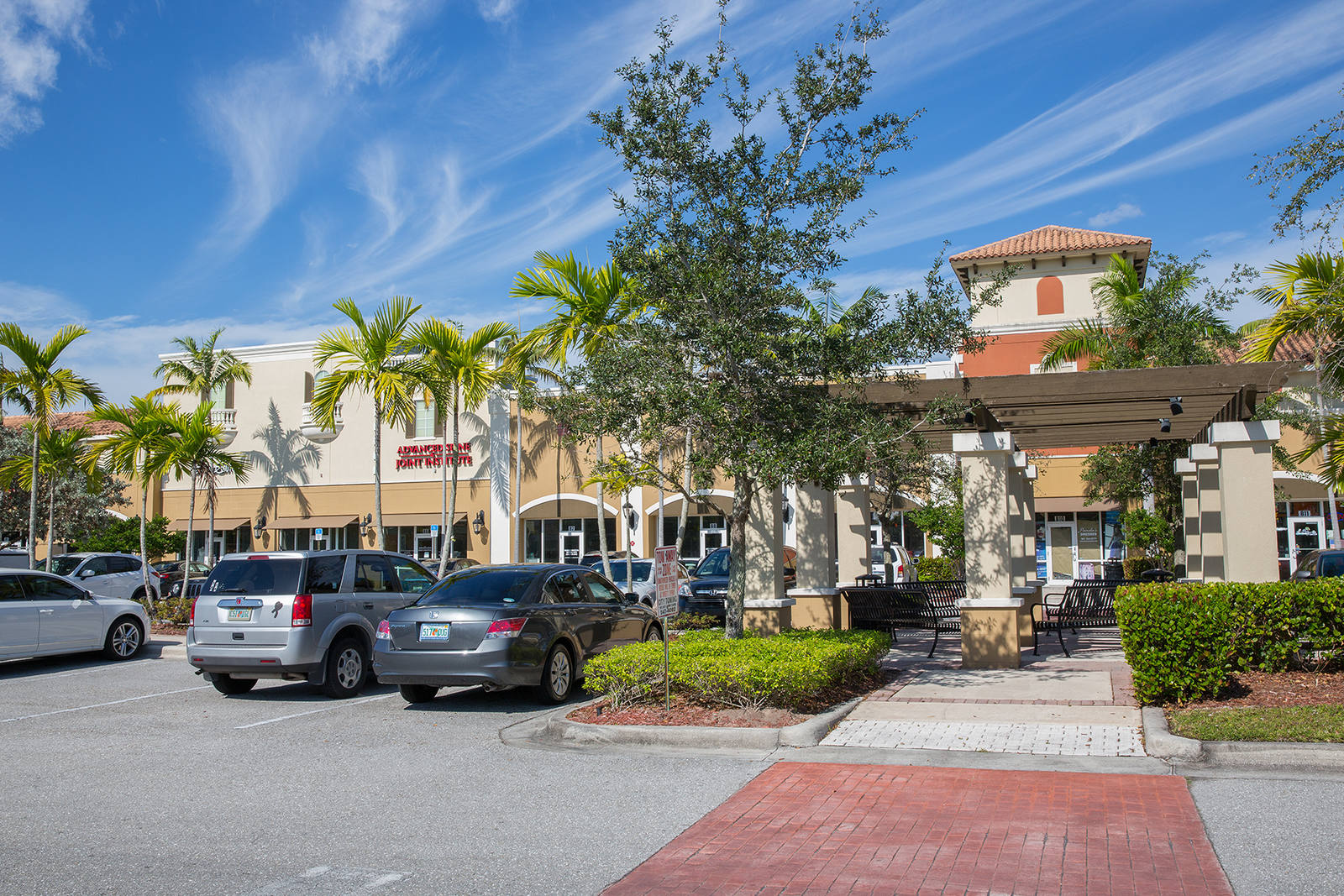 Palm trees, trees and shrubs adorn the outdoor seating at Cobblestone Village.