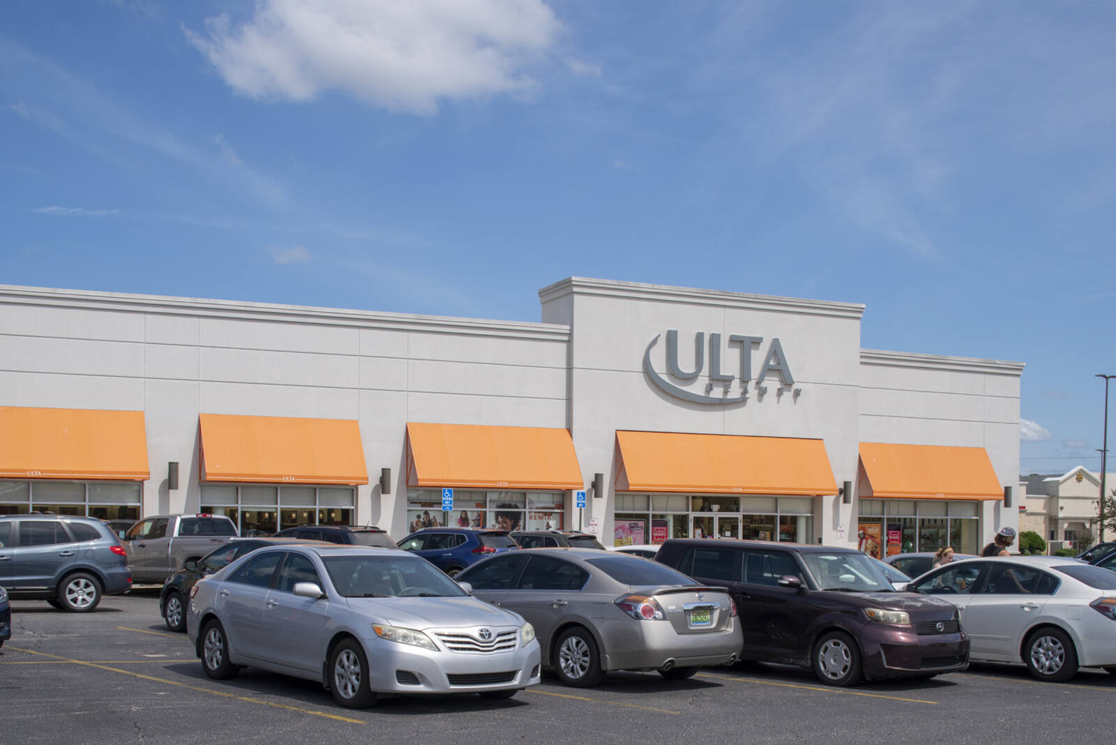 Cars parked in the parking lot of Ulta Beauty at Springdale shopping center
