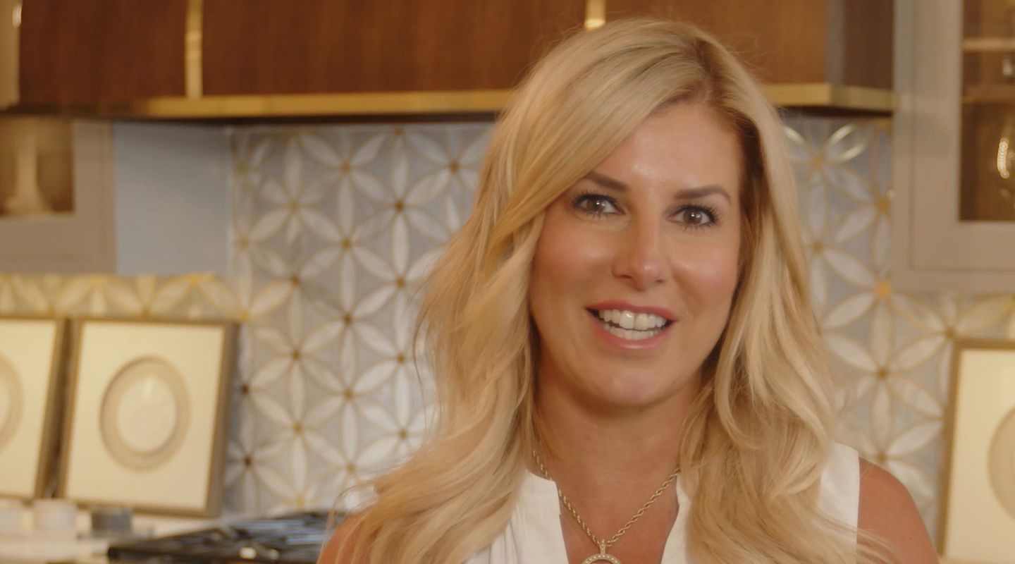 Blonde woman wearing a white dress inside of a home decor store