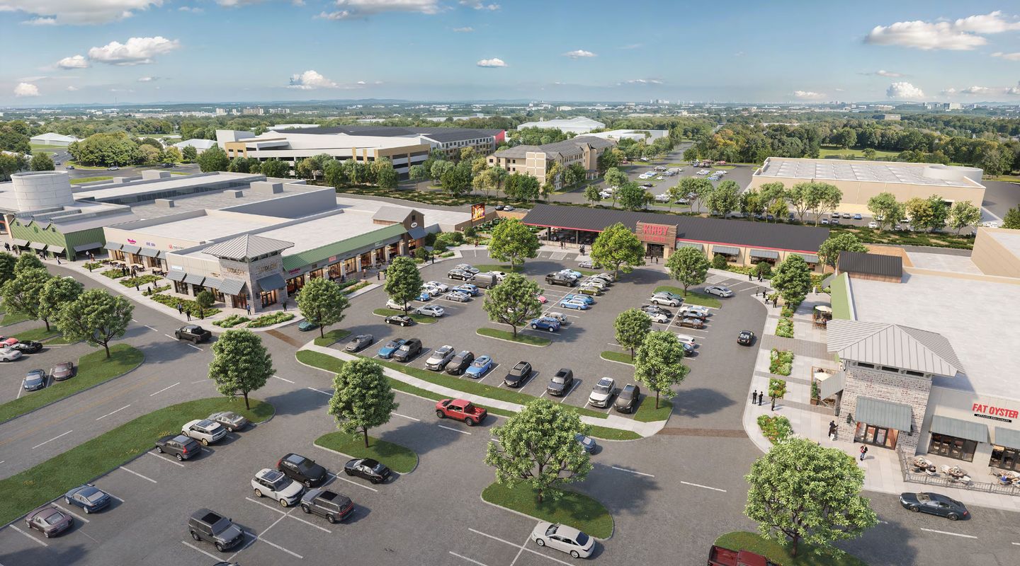 Aerial view of the Market Plaza redevelopment highlighting new retail and restaurant concepts, improved traffic circulation, expanded landscaping, outdoor dining destinations, modern storefront façades, and convenient parking throughout the shopping center.