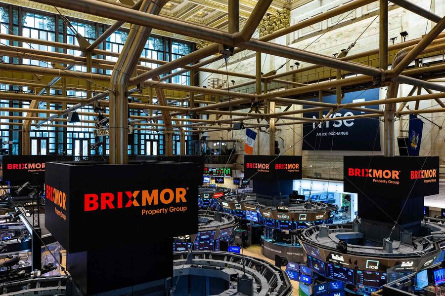 Balcony view of the New York Stock Exchange floor with Brixmor logos on the screens